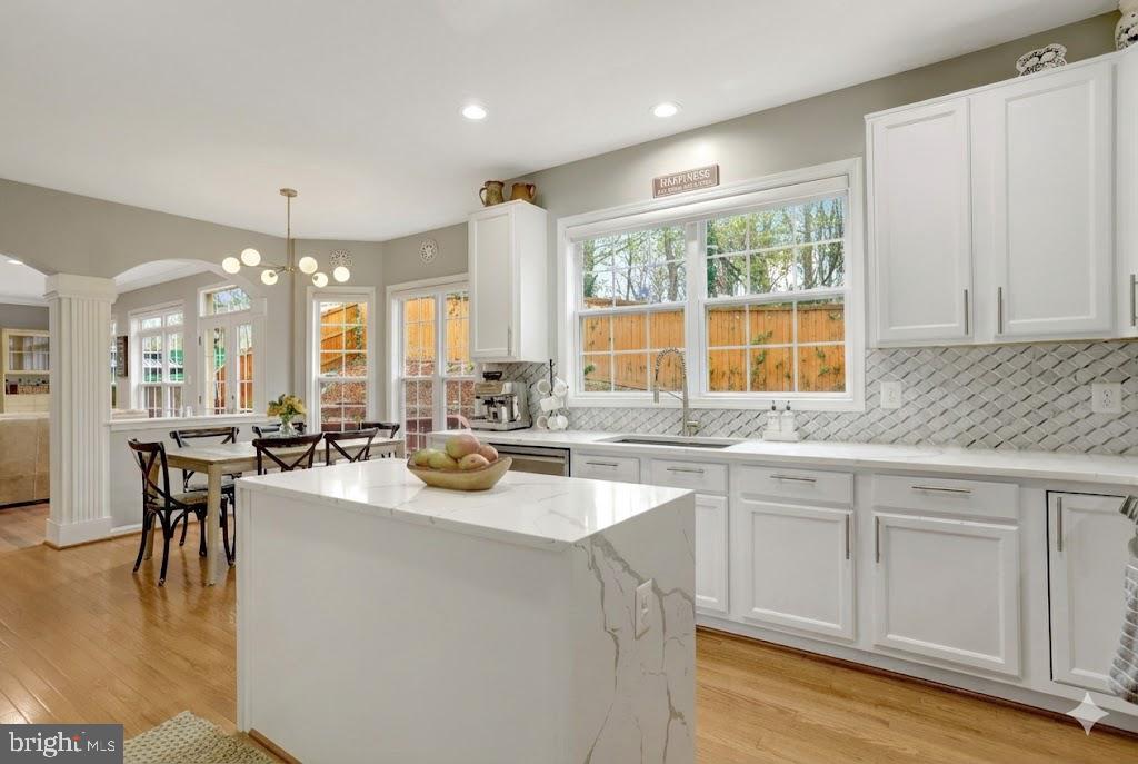 7374 Pohick Ridge Court Springfield, VA 22153 - Photo 11 of 58 a kitchen with a sink stove and cabinets