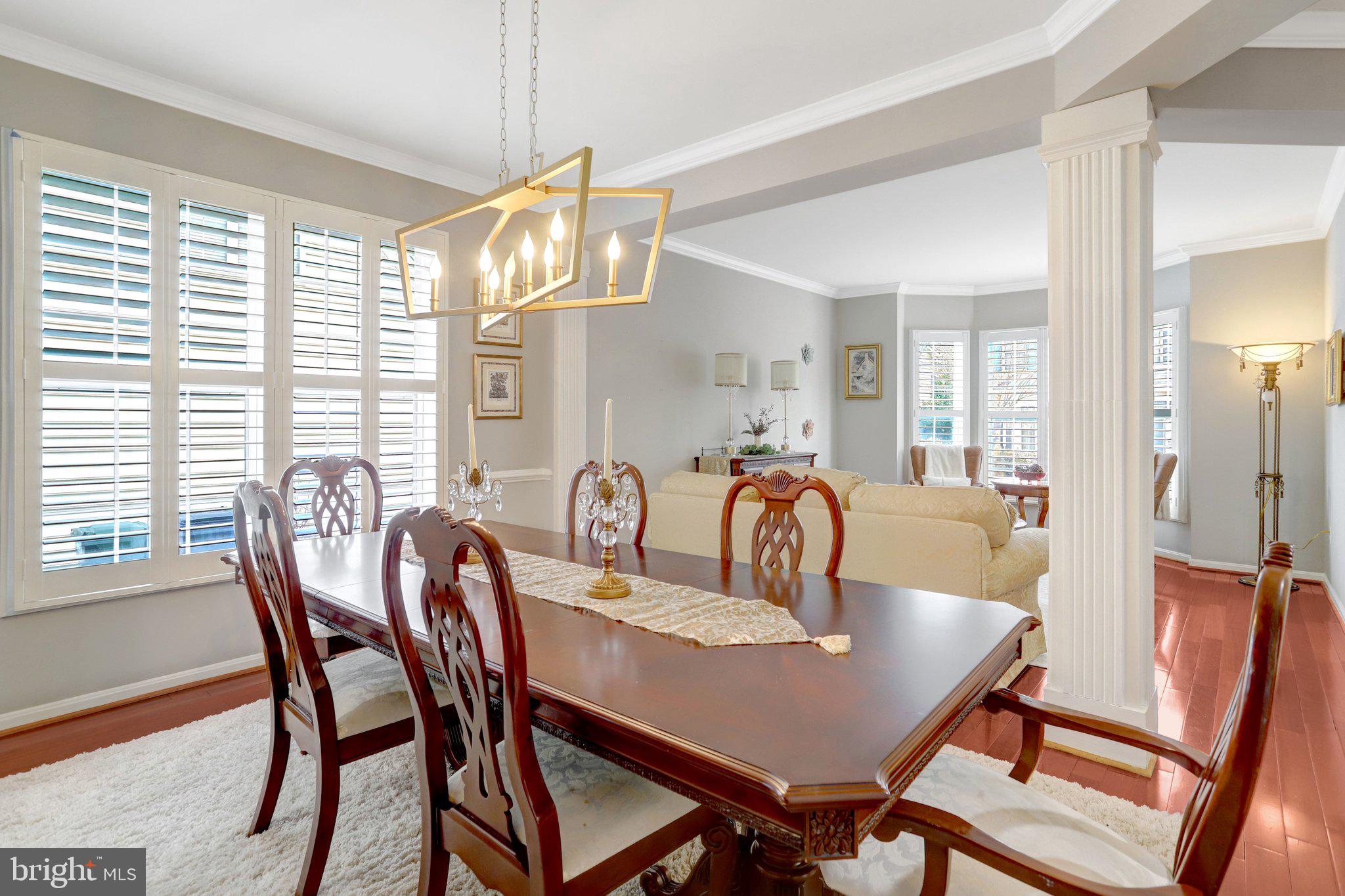 7374 Pohick Ridge Court Springfield, VA 22153 - Photo 15 of 58 a view of a dining room with furniture window and wooden floor