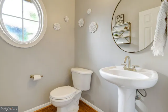 a bedroom with furniture and a large window