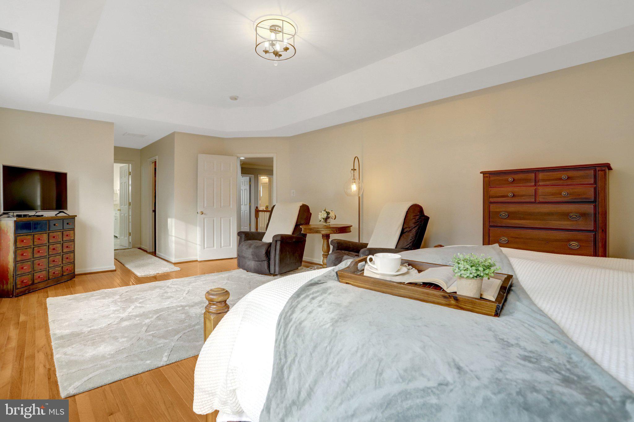 7374 Pohick Ridge Court Springfield, VA 22153 - Photo 19 of 58 a spacious bedroom with a bed and dresser