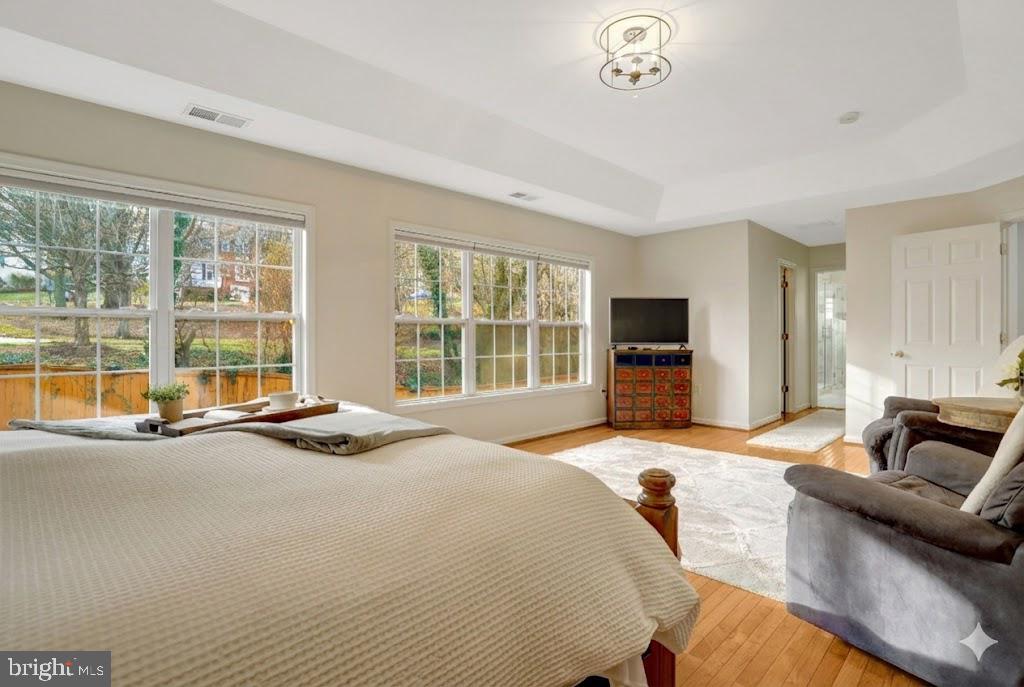 7374 Pohick Ridge Court Springfield, VA 22153 - Photo 20 of 58 a spacious bedroom with a bed and glass window