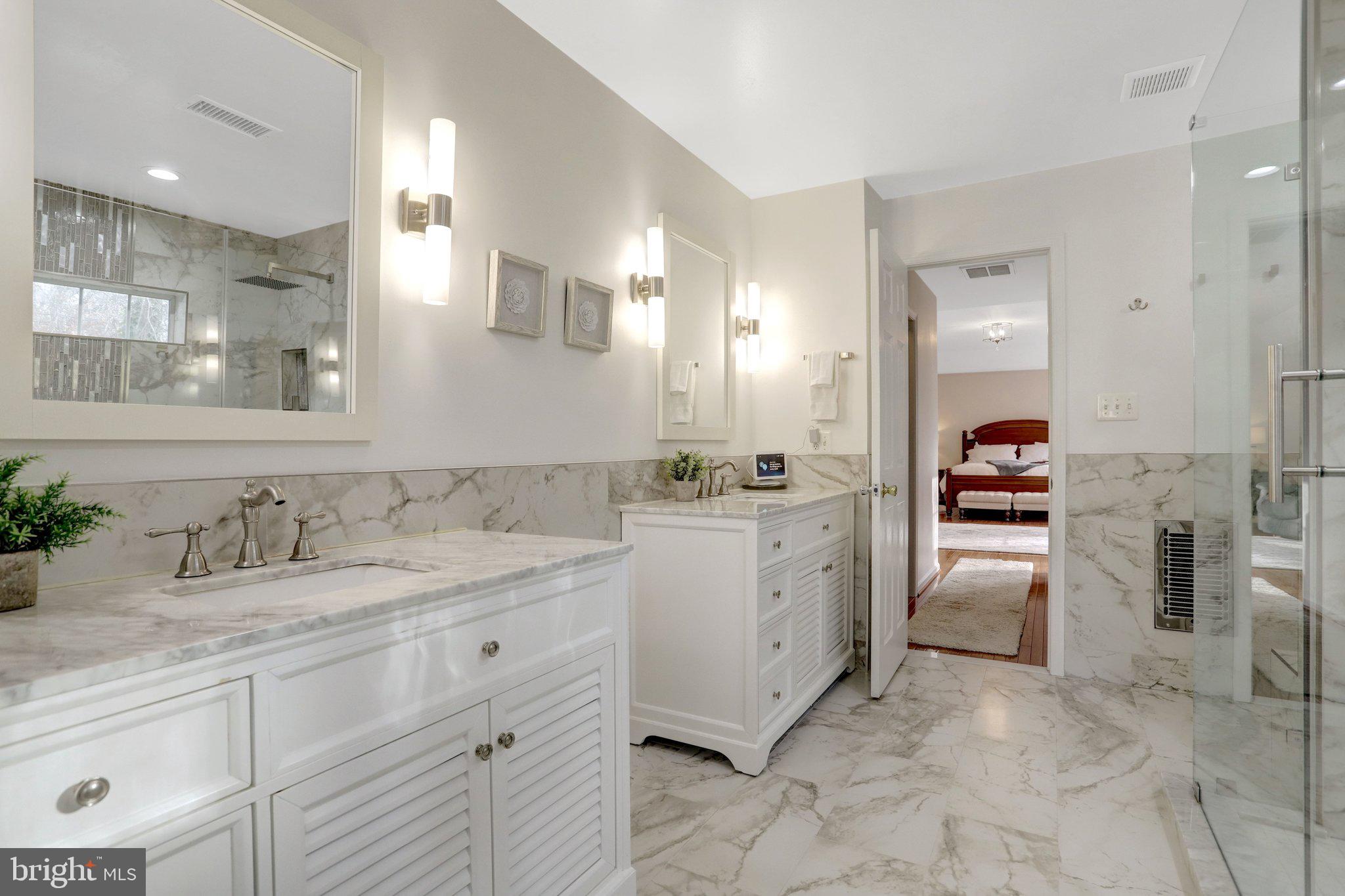 7374 Pohick Ridge Court Springfield, VA 22153 - Photo 23 of 58 a bathroom with a sink and a mirror