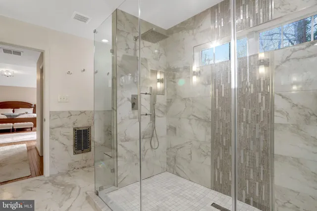 a bedroom with a large bed and furniture