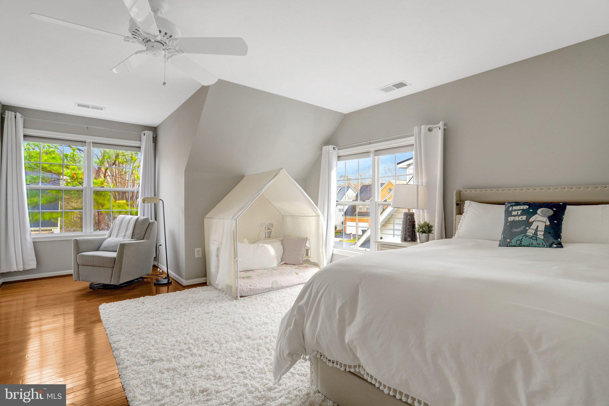 7374 Pohick Ridge Court Springfield, VA 22153 - Photo 26 of 58 a bedroom with a large bed and furniture