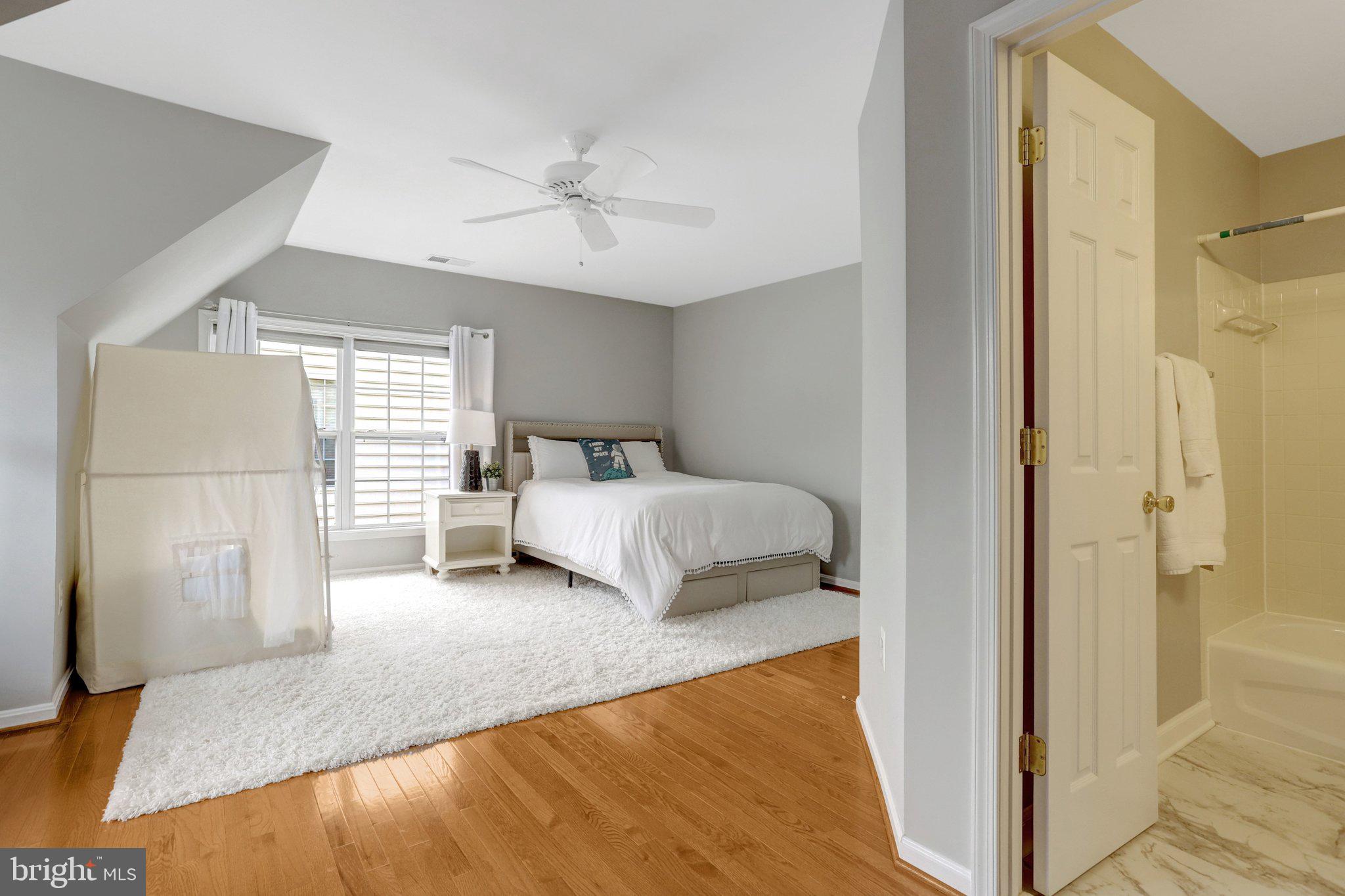 7374 Pohick Ridge Court Springfield, VA 22153 - Photo 27 of 58 a bedroom with a bed and a window
