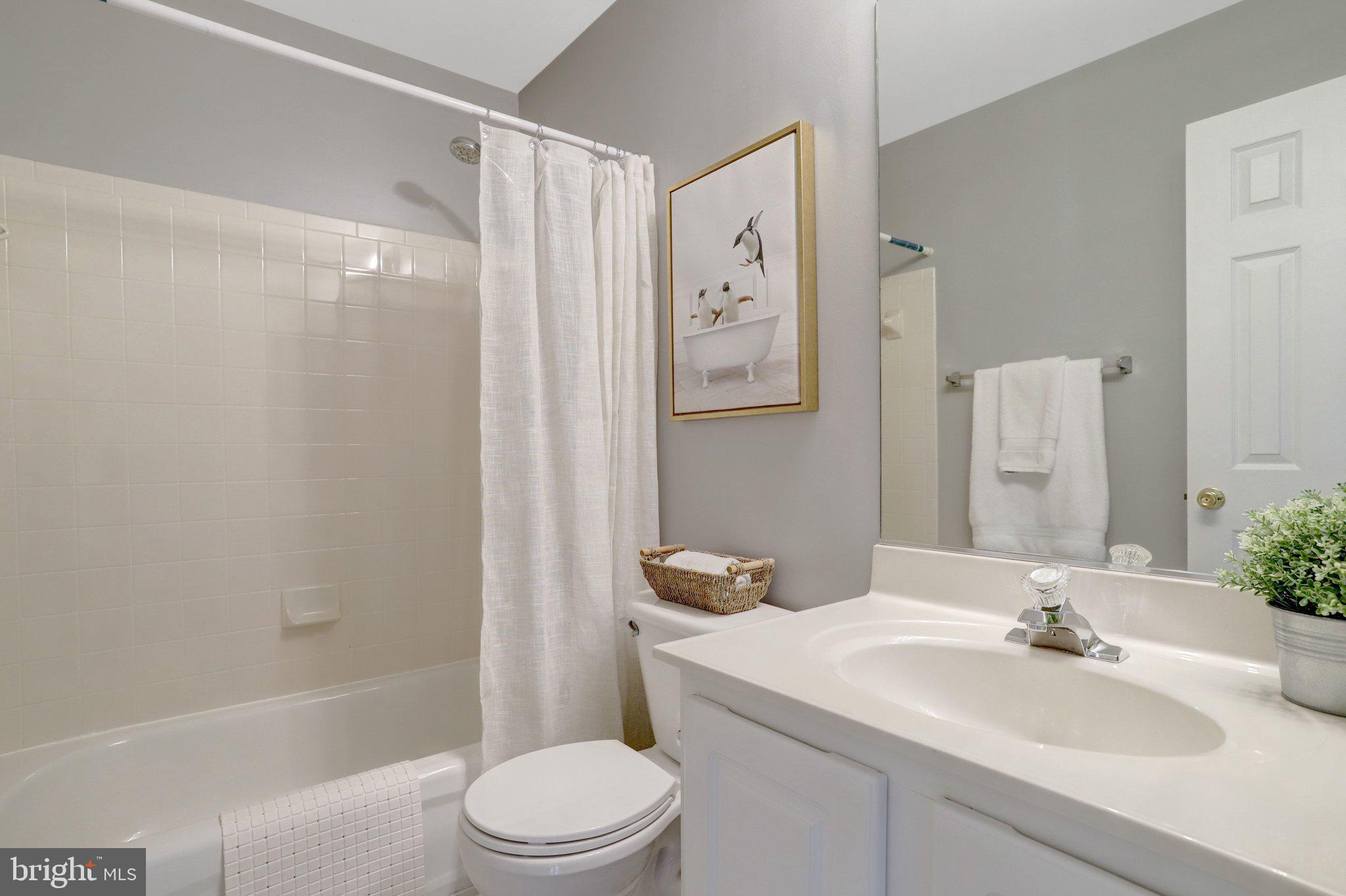 7374 Pohick Ridge Court Springfield, VA 22153 - Photo 30 of 58 a bathroom with a sink toilet and shower