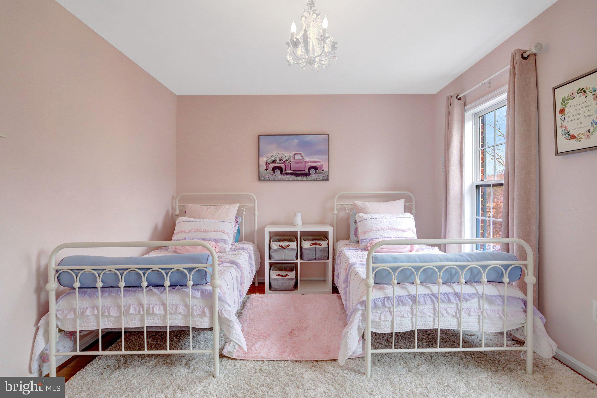 7374 Pohick Ridge Court Springfield, VA 22153 - Photo 33 of 58 a bedroom with two beds and a chair