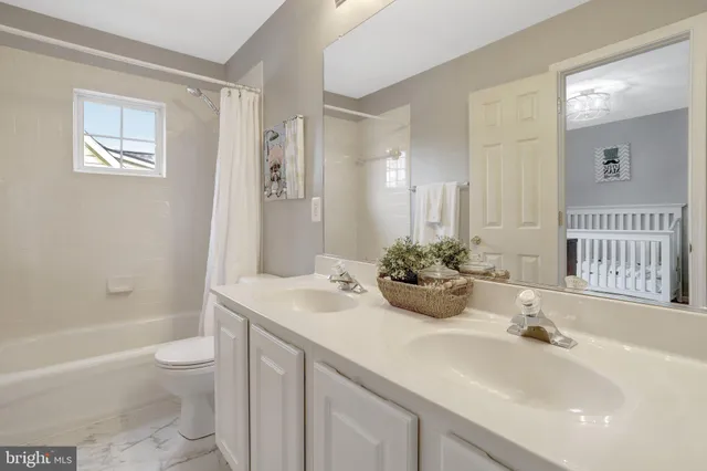 a view of room with furniture and wooden floor