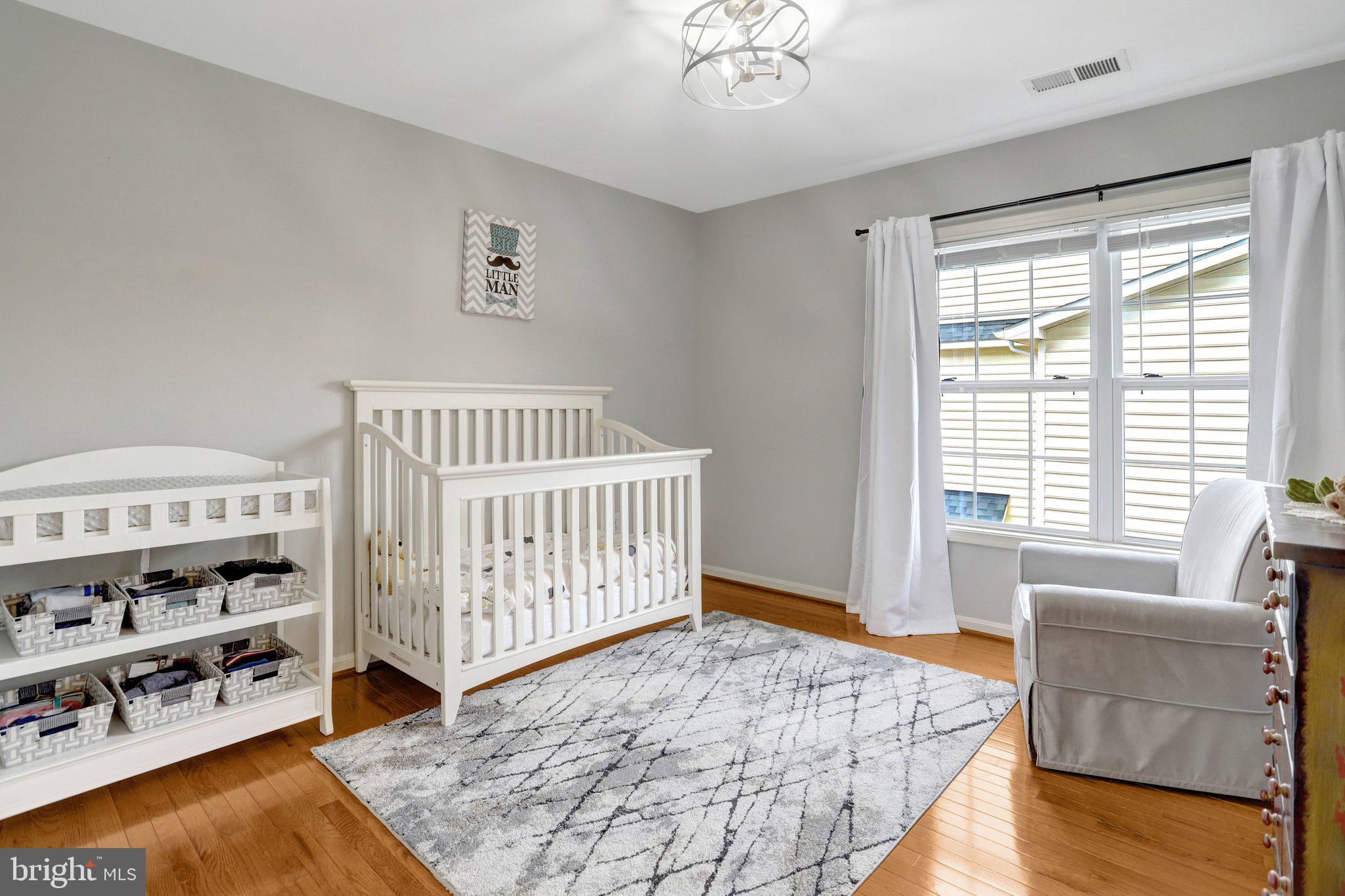 7374 Pohick Ridge Court Springfield, VA 22153 - Photo 36 of 58 a bedroom with furniture and a window