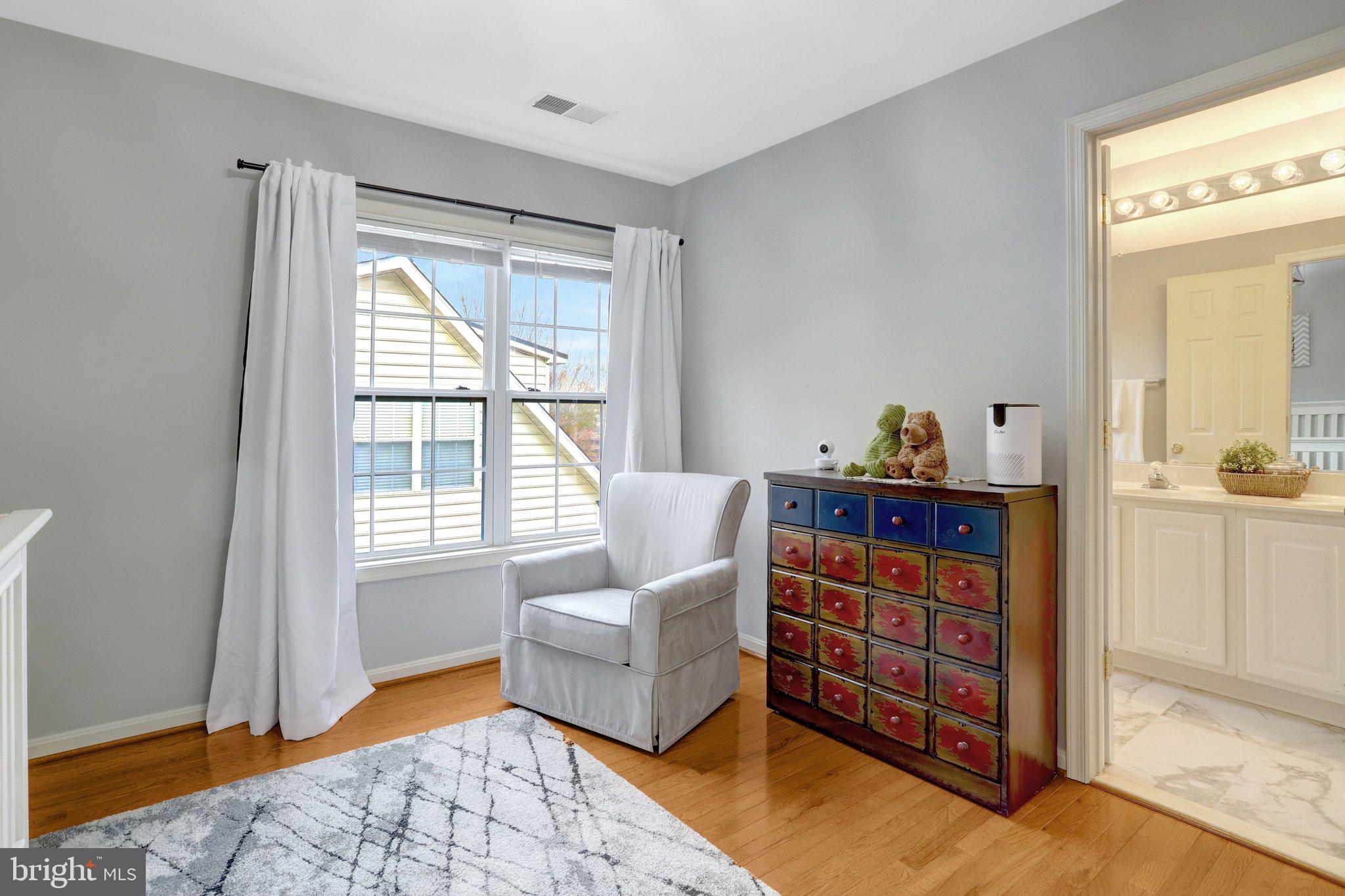 7374 Pohick Ridge Court Springfield, VA 22153 - Photo 37 of 58 a living room with furniture and a window