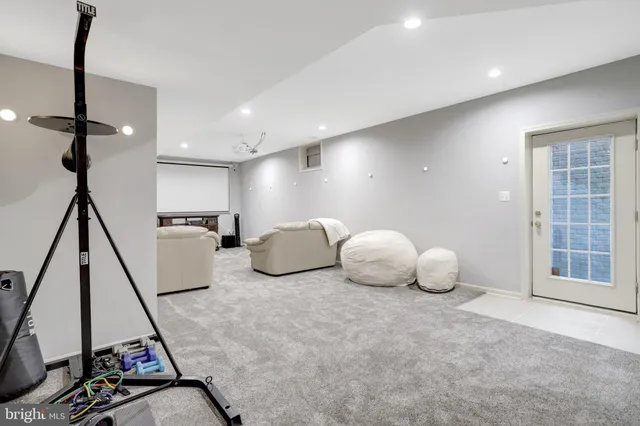 a kitchen with granite countertop stainless steel appliances a refrigerator sink and microwave