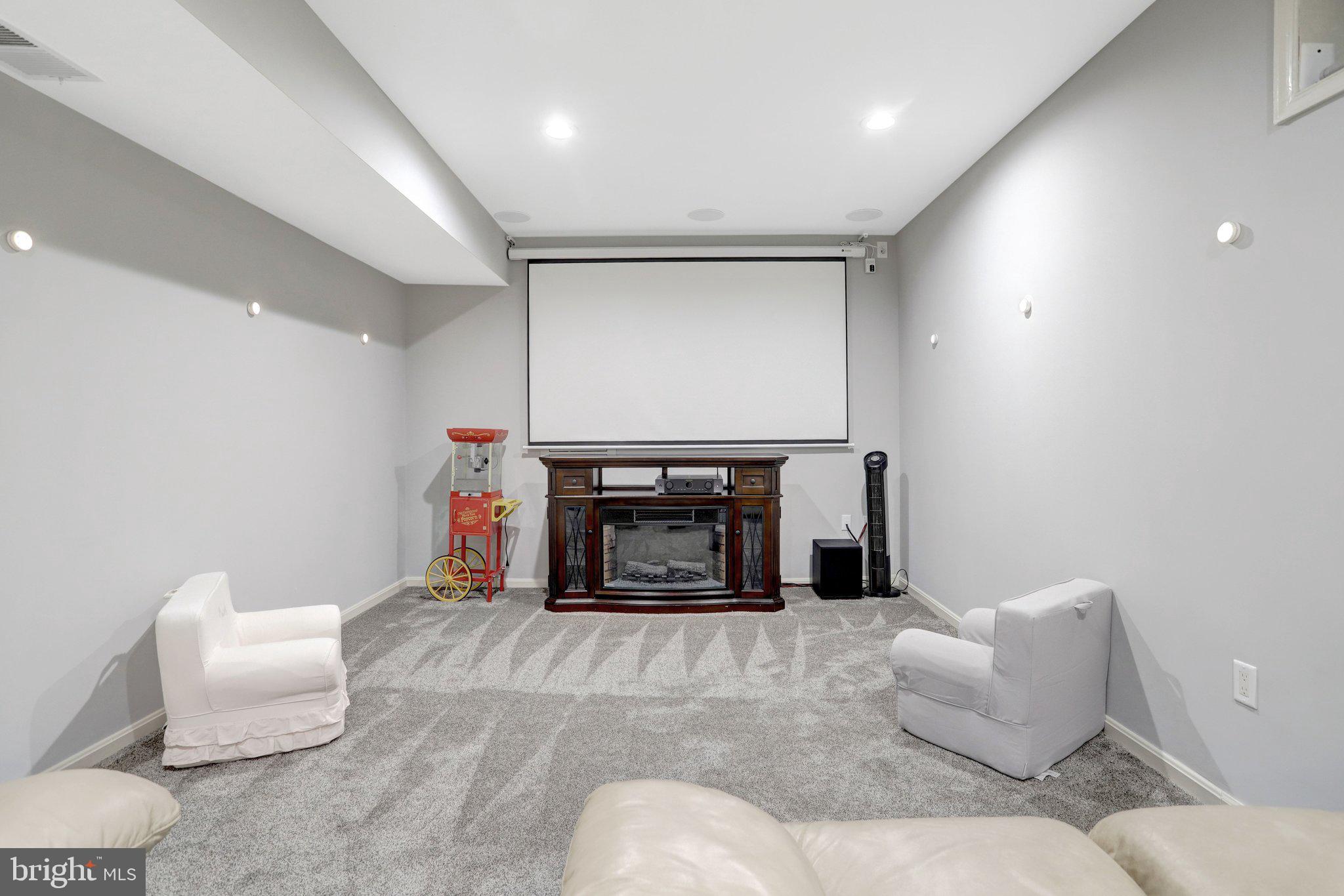 7374 Pohick Ridge Court Springfield, VA 22153 - Photo 43 of 58 a living room with furniture and a fireplace