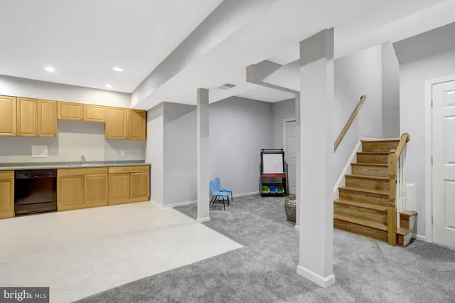 a view of a house with pool and sitting area