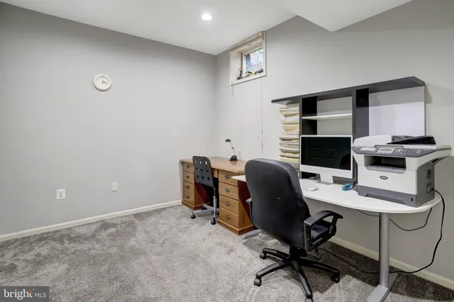 a view of wooden floor with seating space