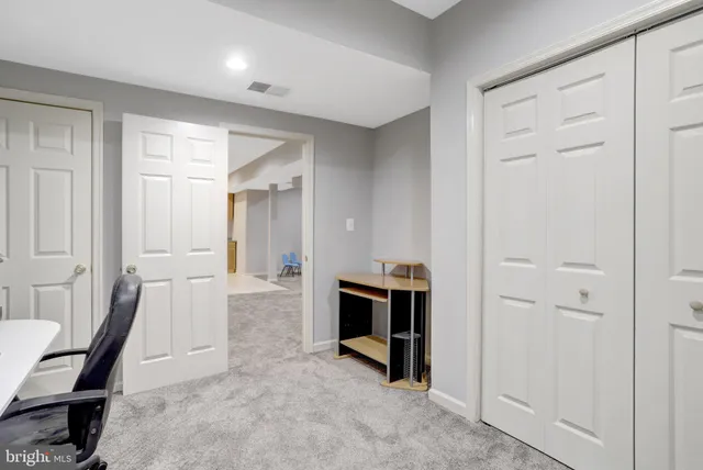 a picture of a room with a white wall and a picture