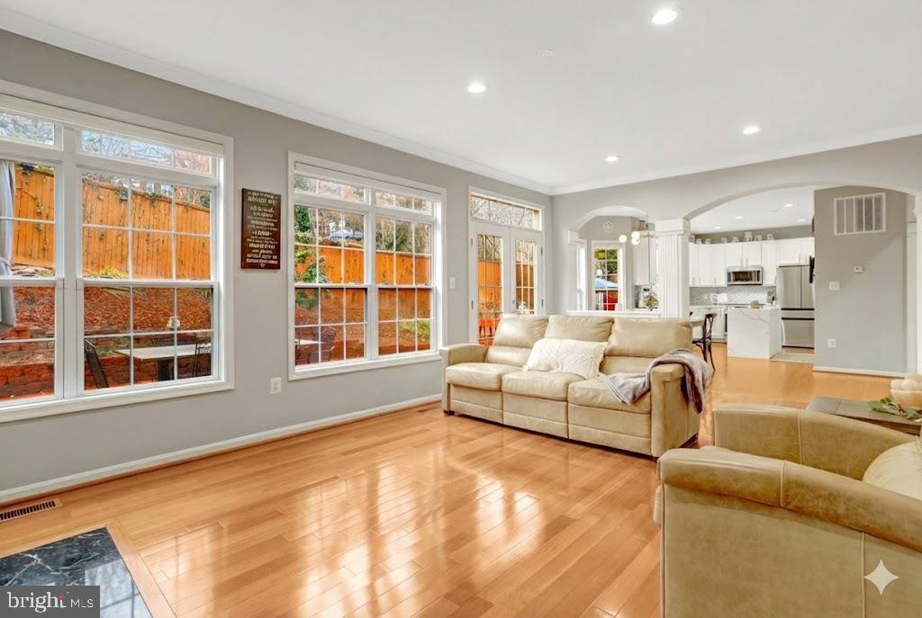7374 Pohick Ridge Court Springfield, VA 22153 - Photo 7 of 58 a living room with furniture and floor to ceiling windows