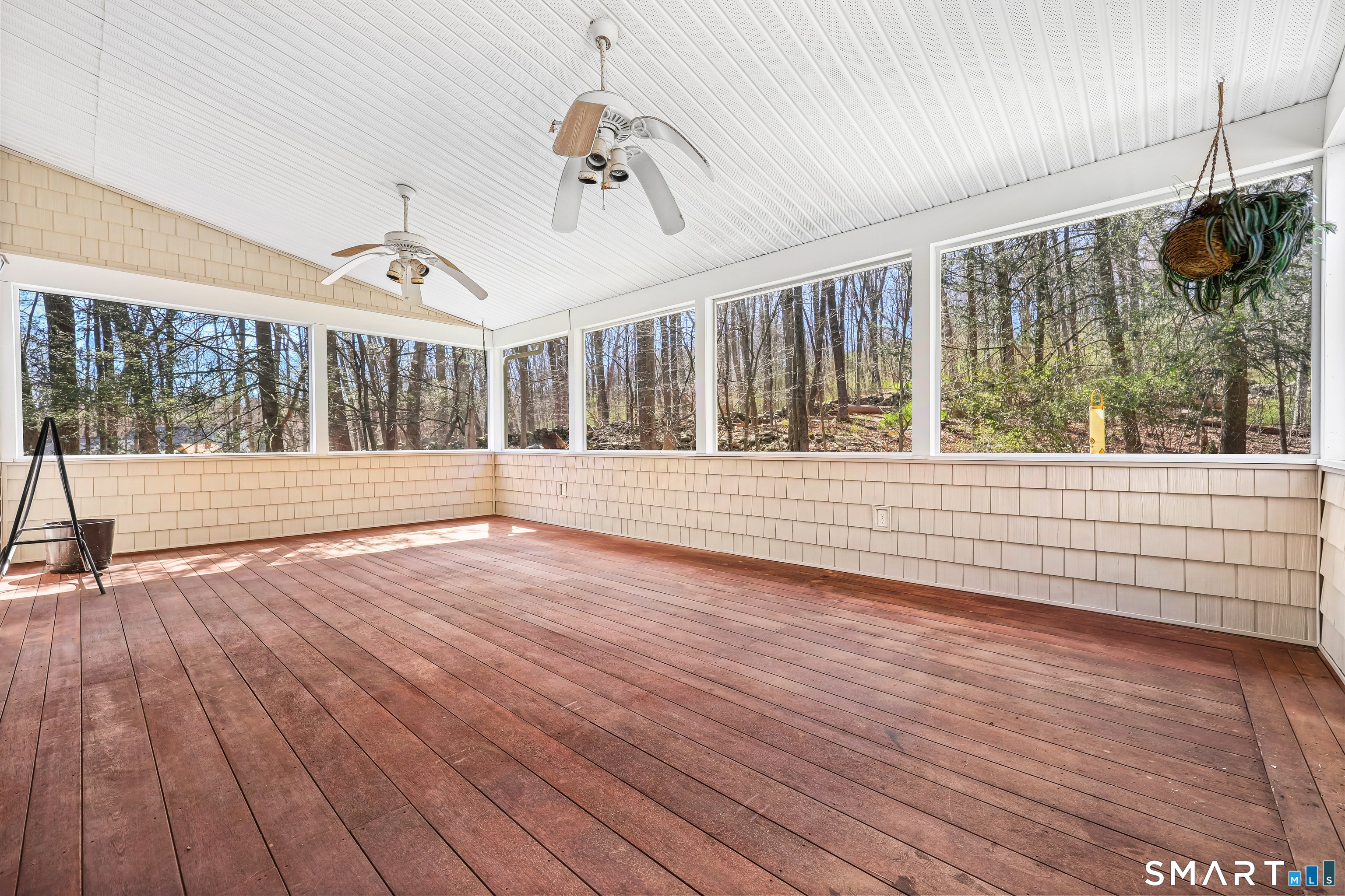 145 Wilton Road East Ridgefield, CT 06877 - Photo 15 of 35 a view of an empty room with wooden floor and a window