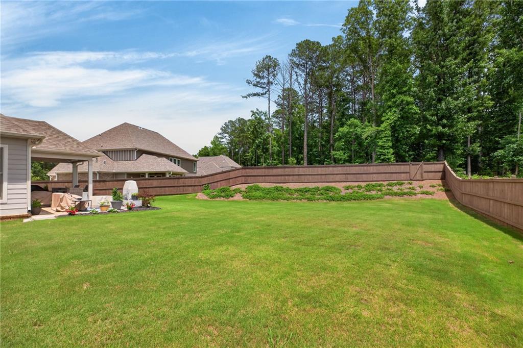 139 Manchester Lane Villa Rica, GA 30180 - Photo 47 of 60 a view of a big house with a big yard and large trees