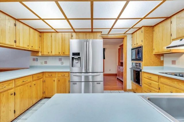 a bathroom with a sink a toilet and a shower