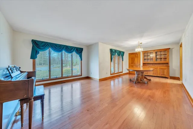 a view of livingroom with hardwood floor and a ceiling fan