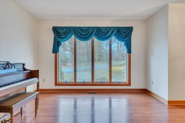 a dining room with table chairs and chandelier