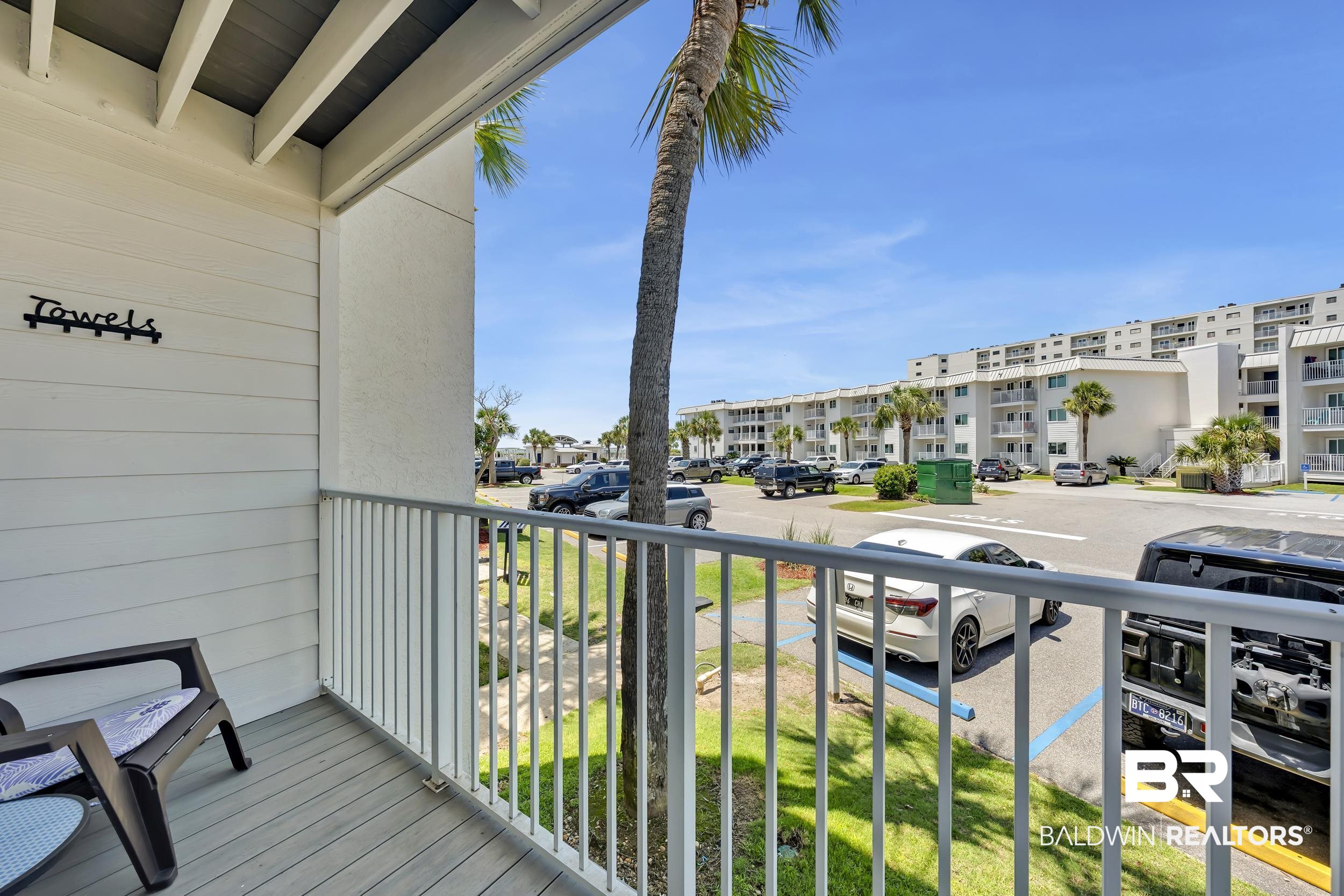 400 Plantation Road, Unit 2118 Gulf Shores, AL 36542 - Photo 22 of 59 Private balcony with plank flooring and white paneling