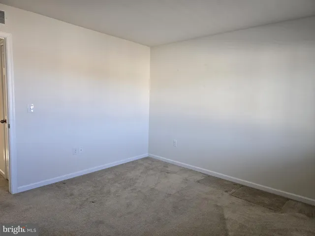 an empty room with a bench