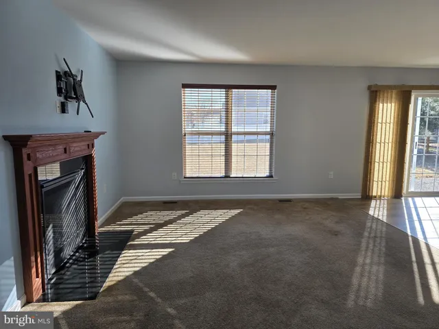 a view of a livingroom with a fireplace