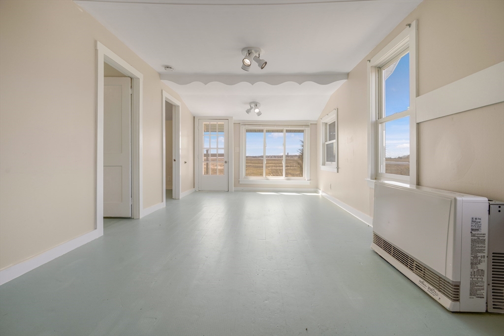 7 Shawmut Street Fairhaven, MA 02719 - Photo 13 of 39 wooden floor in an empty room with a window