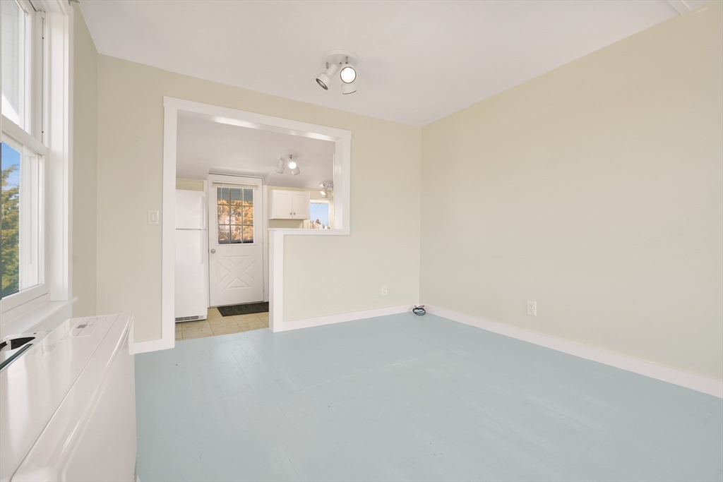 7 Shawmut Street Fairhaven, MA 02719 - Photo 15 of 39 an empty room with windows and entrance