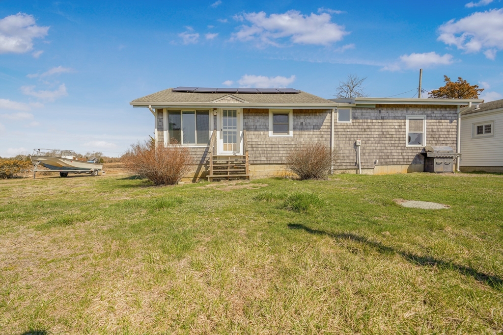 7 Shawmut Street Fairhaven, MA 02719 - Photo 20 of 39 a front view of house with yard and seating space