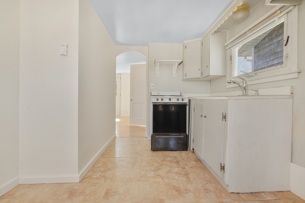 7 Shawmut Street Fairhaven, MA 02719 - Photo 28 of 39 a view of kitchen with granite countertop cabinets and refrigerator