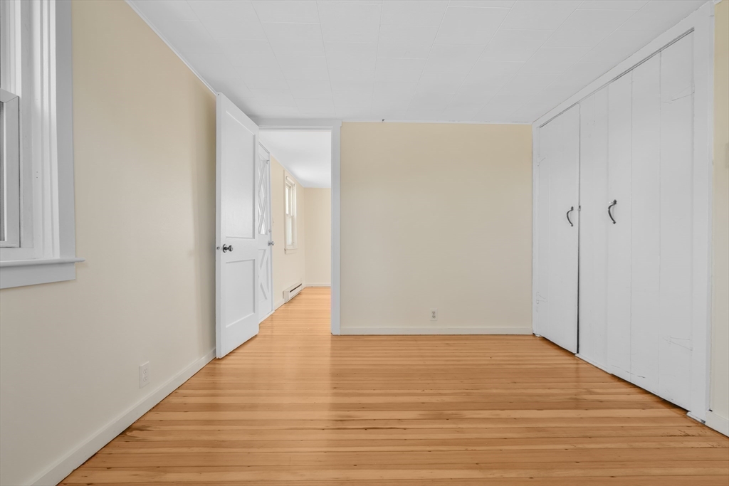 7 Shawmut Street Fairhaven, MA 02719 - Photo 31 of 39 a view of an empty room with wooden floor