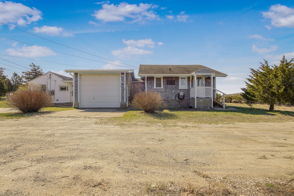 7 Shawmut Street Fairhaven, MA 02719 - Photo 6 of 39 a front view of a house with a garden