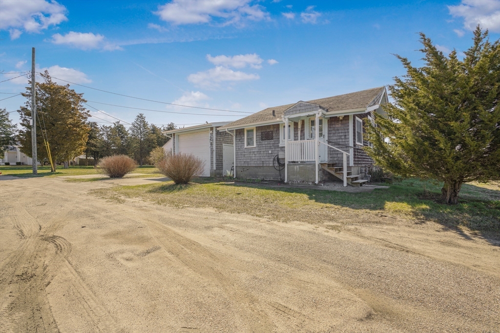7 Shawmut Street Fairhaven, MA 02719 - Photo 7 of 39 a front view of a house with a yard and garage