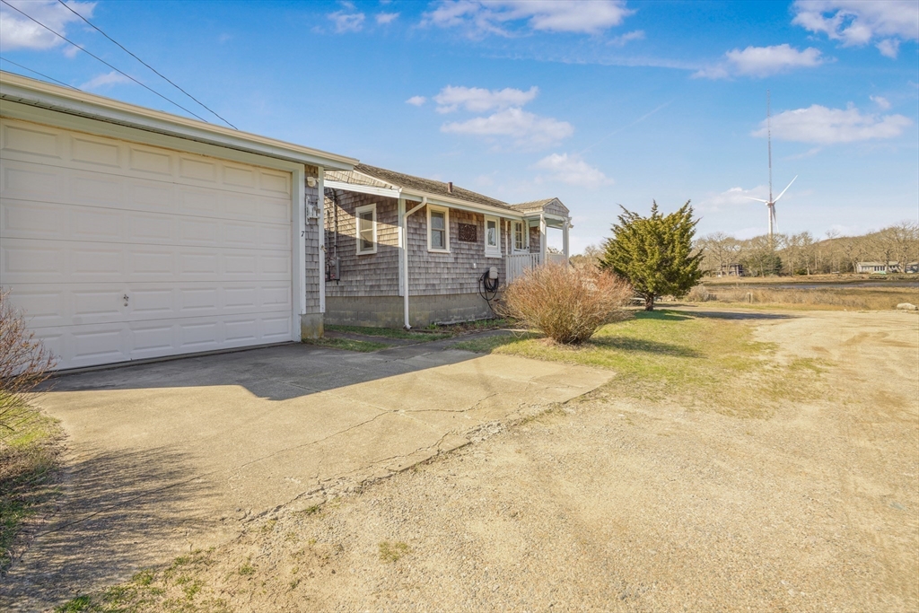 7 Shawmut Street Fairhaven, MA 02719 - Photo 8 of 39 a front view of a house with a yard