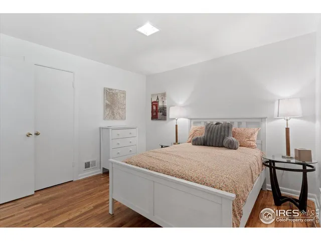 a bedroom with a bed and a table in it