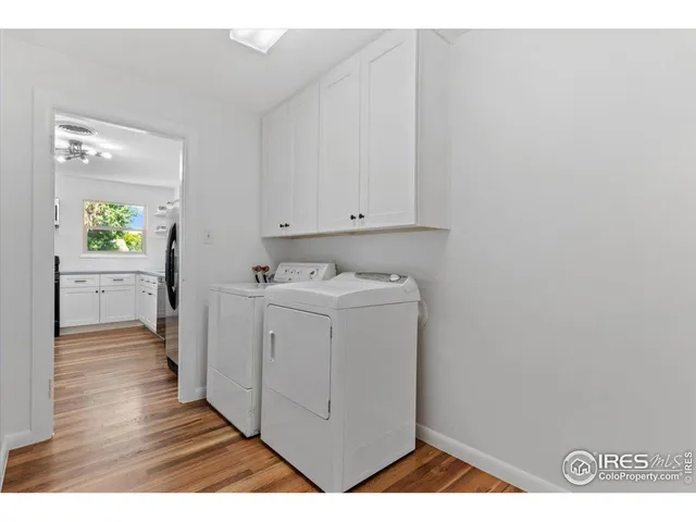 a view of hallway with wooden floor