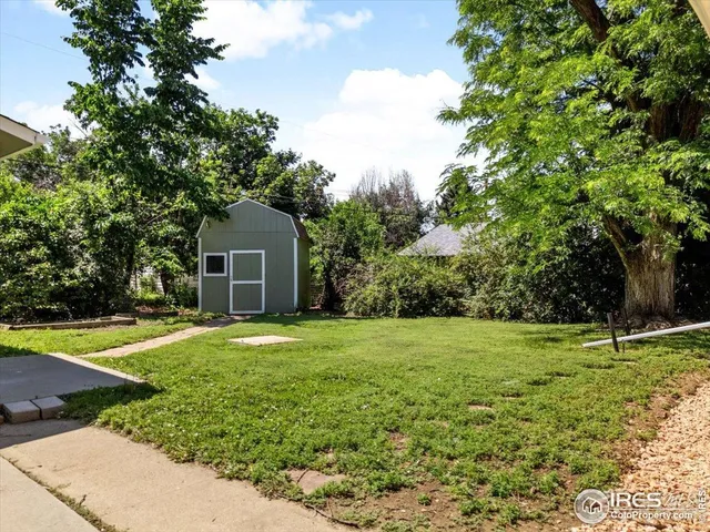a house with a trees in front of it