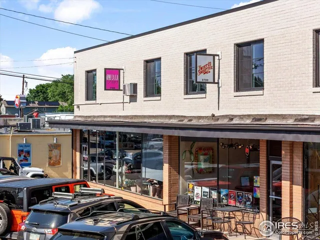a outdoor area with a table and chairs