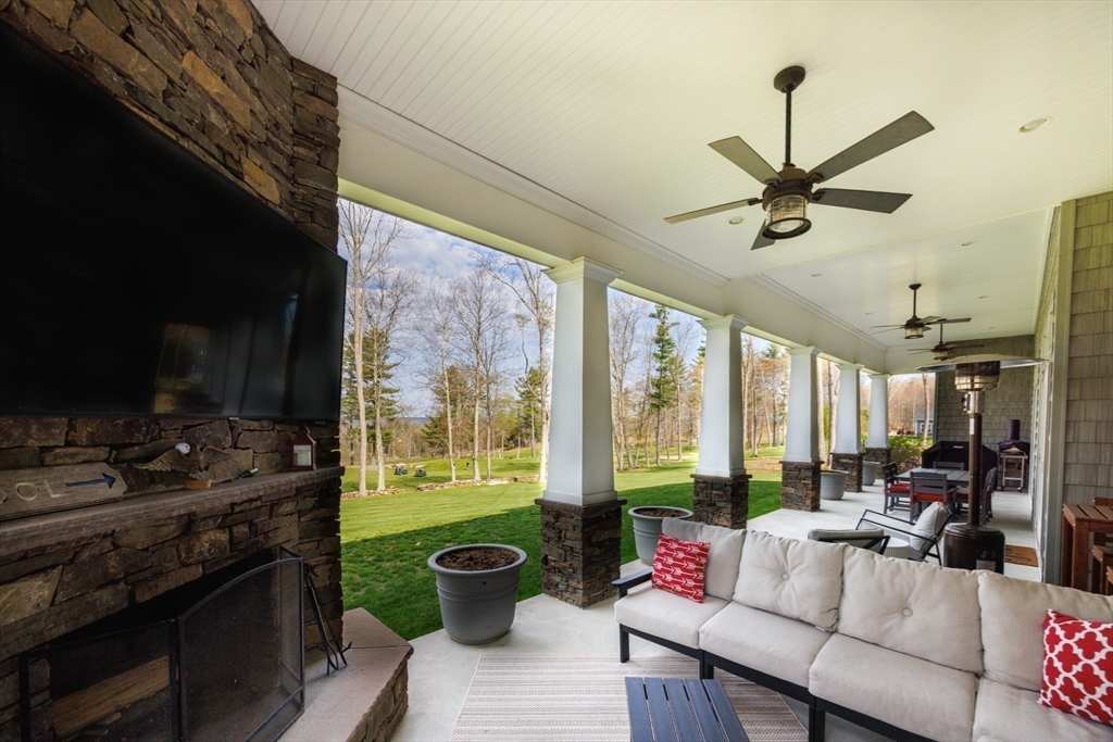 1776 Old Turnpike Road Oakham, MA 01068 - Photo 31 of 42 a living room with furniture and a floor to ceiling window