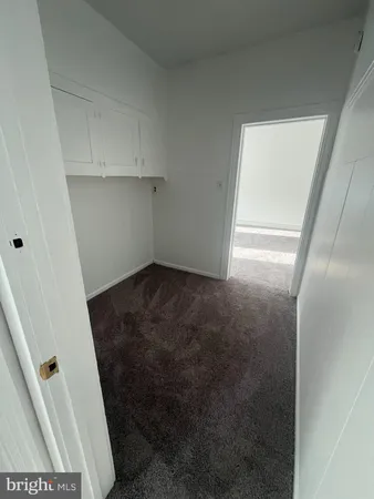 a view of storage and utility room with a sink