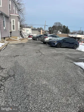 a view of street with parked cars