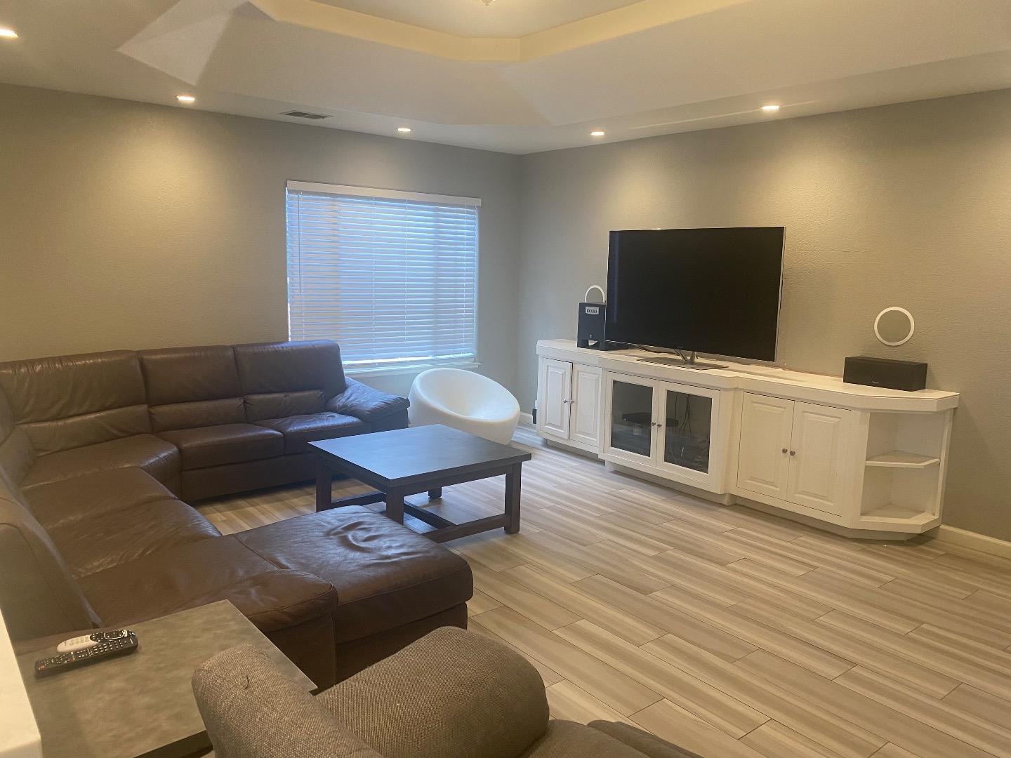 1672 Merrill Loop San Jose, CA 95124 - Photo 2 of 10 a living room with furniture and a flat screen tv