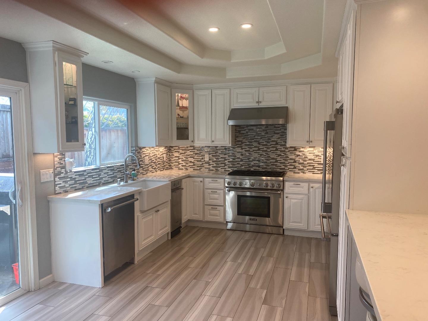 1672 Merrill Loop San Jose, CA 95124 - Photo 3 of 10 a kitchen with a stove and white cabinets