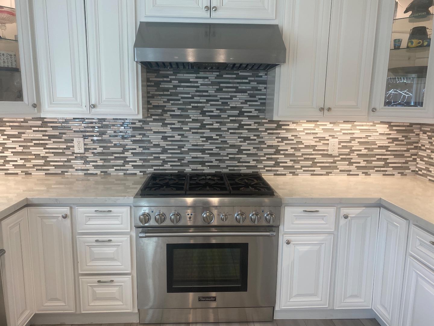 1672 Merrill Loop San Jose, CA 95124 - Photo 4 of 10 a stove top oven sitting inside of a kitchen