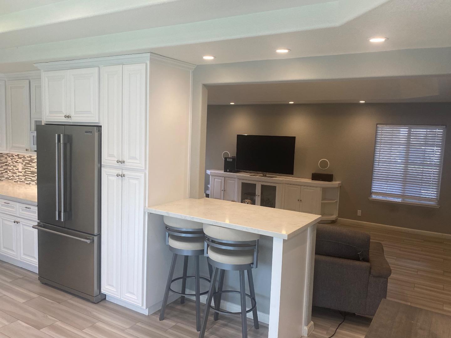 1672 Merrill Loop San Jose, CA 95124 - Photo 5 of 10 a kitchen with stainless steel appliances a refrigerator and a stove top oven