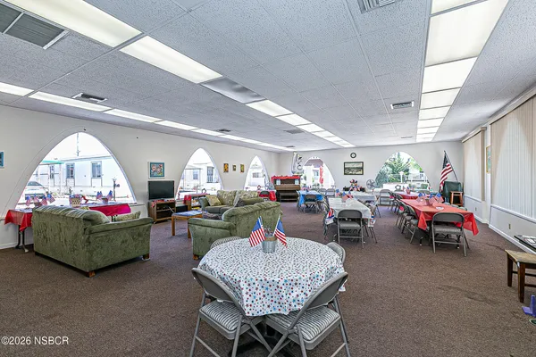 a kitchen with sink a stove and cabinets