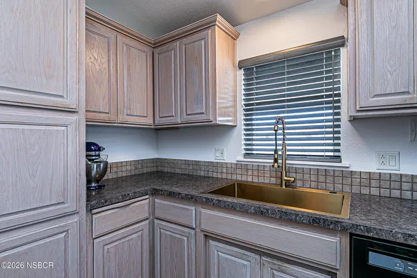 a kitchen with stainless steel appliances granite countertop a stove and a microwave