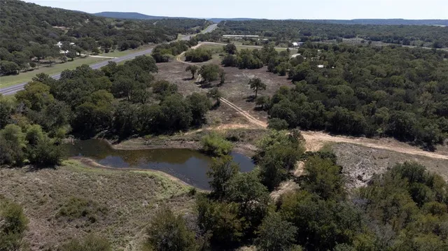 an aerial view of mountain with trees